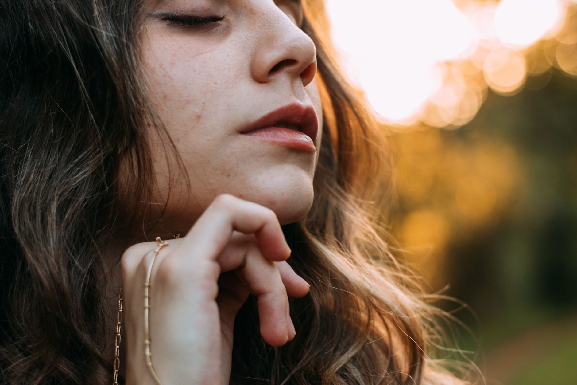 Woman with glowing skin in golden hour light